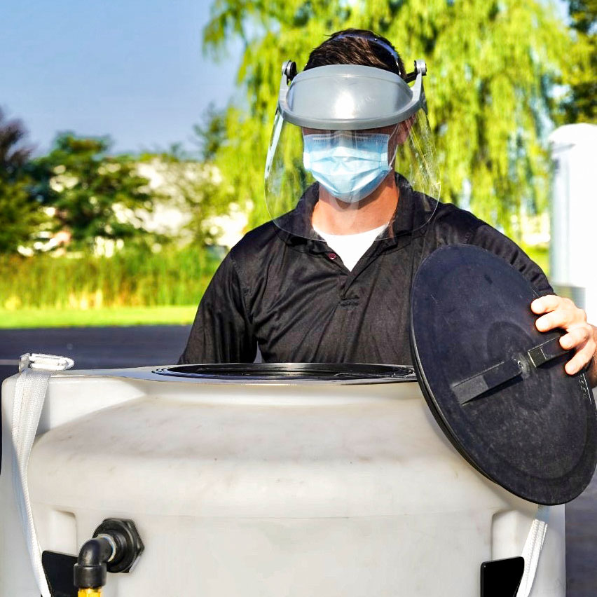 man opening lads-large are decontamination system tank
